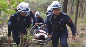 Emergency rescue team carrying a stretcher during field response — applicable scene for G808 smart safety helmet